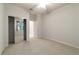 Spacious bedroom with mirrored closet doors and window at 9948 Sw 69Th Ln, Ocala, FL 34481