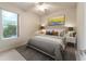 Comfortable bedroom featuring a queen bed and window at 9948 Sw 69Th Ln, Ocala, FL 34481