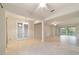 Open concept dining room with tile floors and access to the kitchen at 9948 Sw 69Th Ln, Ocala, FL 34481
