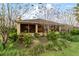 Single story home with screened lanai and manicured landscaping at 9948 Sw 69Th Ln, Ocala, FL 34481