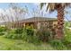 Single story home with screened lanai and well-maintained landscaping at 9948 Sw 69Th Ln, Ocala, FL 34481