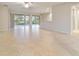 Large living room with tile floors and access to lanai at 9948 Sw 69Th Ln, Ocala, FL 34481