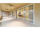 Screened lanai with glass doors, and a view into the kitchen at 9948 Sw 69Th Ln, Ocala, FL 34481
