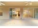 Spacious screened lanai with glass sliders and ceiling fan, offering views of the backyard at 9948 Sw 69Th Ln, Ocala, FL 34481