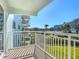 Balcony overlooking lush landscaping, building, and partial water view at 100 Silver Beach Ave # 304, Daytona Beach, FL 32118