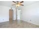 Bright bedroom with ceiling fan and tile flooring at 100 Silver Beach Ave # 304, Daytona Beach, FL 32118