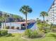 Covered parking with lush landscaping and river views at 100 Silver Beach Ave # 304, Daytona Beach, FL 32118