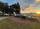 Community entrance with signage and landscaping at sunset at 10463 Sw 85Th Ct, Ocala, FL 34481