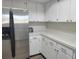 Kitchen with stainless steel refrigerator and white cabinets at 10865 Sw 78Th Ct, Ocala, FL 34476