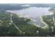 Aerial view of community lake and surrounding landscape at 111 Sw Sycamore Rd, Dunnellon, FL 34431