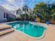 Relaxing kidney-shaped pool with surrounding patio at 11520 Se 54Th Ave, Belleview, FL 34420