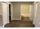 Hallway with vinyl flooring and access to bedrooms and bathroom at 14271 Se 33 Ter, Summerfield, FL 34491