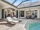 Relaxing pool and patio area with lounge chairs and covered seating at 1435 Se 73Rd Pl, Ocala, FL 34480