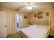 Spacious bedroom with a queen-size bed and ensuite bathroom access at 16690 Sw 50Th Ave, Ocala, FL 34473