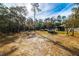 Large backyard with a above ground pool and wooded area at 21 Sw Buena Vista Rd, Dunnellon, FL 34431