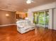 Bright living room with hardwood floors, recessed lighting, and view to kitchen at 2629 Sw 20Th Cir, Ocala, FL 34471