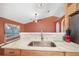 Kitchen island with a sink and granite countertop at 3011 Se 46Th Ave, Ocala, FL 34480