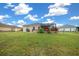 Spacious backyard with screened patio and lush landscaping at 3803 Se 6Th Ave, Ocala, FL 34480