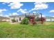 Landscaped backyard showcasing home's exterior and patio at 3803 Se 6Th Ave, Ocala, FL 34480