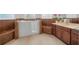 Bathroom with walk-in tub, tiled walls, and vanity at 3803 Se 6Th Ave, Ocala, FL 34480