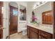 Bathroom with walk-in shower, toilet, and vanity with marble top at 3803 Se 6Th Ave, Ocala, FL 34480