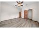 Bedroom with wood-look floors and double door closet at 3803 Se 6Th Ave, Ocala, FL 34480