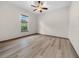 Bright bedroom with wood-look floors and ceiling fan at 3803 Se 6Th Ave, Ocala, FL 34480