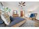 Bedroom with hardwood floors, ceiling fan, and wood dresser at 3803 Se 6Th Ave, Ocala, FL 34480