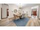 Elegant dining room with a rustic wooden table and chandelier at 3803 Se 6Th Ave, Ocala, FL 34480