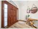 Interior entry featuring a wooden door and a unique console table at 3803 Se 6Th Ave, Ocala, FL 34480