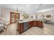 Kitchen features granite island, stainless steel appliances, and wood cabinets at 3803 Se 6Th Ave, Ocala, FL 34480