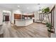 Open living area with hardwood floors and kitchen views at 3803 Se 6Th Ave, Ocala, FL 34480