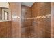 Walk-in shower with tiled walls and grab bars at 3803 Se 6Th Ave, Ocala, FL 34480