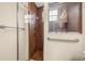 Walk-in shower with tiled walls and grab bar at 3803 Se 6Th Ave, Ocala, FL 34480