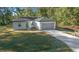 Newly built home with gray garage and modern design at 4 Oak Cir, Ocala, FL 34472