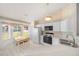 Bright kitchen with white cabinets, breakfast nook, and a view of the backyard at 5065 Nw 21St Loop, Ocala, FL 34482