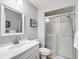 Updated bathroom with vanity, large mirror, and walk-in shower at 5226 Nw 21St Loop, Ocala, FL 34482