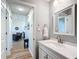 Small bathroom with vanity and mirror, near living room at 5226 Nw 21St Loop, Ocala, FL 34482