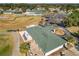 Aerial view of a clubhouse with a green roof and outdoor seating at 5226 Nw 21St Loop, Ocala, FL 34482