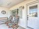 Relaxing front porch with rocking chairs and view of yard at 5226 Nw 21St Loop, Ocala, FL 34482