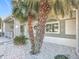 Landscaped front yard with palm trees and white rock at 5226 Nw 21St Loop, Ocala, FL 34482