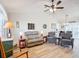 Spacious living room with vaulted ceiling, hardwood floors, and comfortable seating at 5226 Nw 21St Loop, Ocala, FL 34482