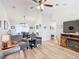 Bright living room with hardwood floors, fireplace, and ample natural light at 5226 Nw 21St Loop, Ocala, FL 34482