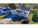 Aerial view of single-story home with gray roof and landscaped yard at 5300 Nw 26Th Ln, Ocala, FL 34482