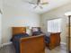 Bedroom with two twin beds, ceiling fan, and wood floors at 5300 Nw 26Th Ln, Ocala, FL 34482