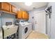 Laundry room with washer, dryer, and utility sink at 5981 Ne 57Th Loop, Silver Springs, FL 34488