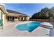 Relaxing pool area with patio furniture and a modern fence at 5981 Ne 57Th Loop, Silver Springs, FL 34488