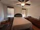 Cozy bedroom with a double bed and ceiling fan at 7289 Hemlock Rd, Ocala, FL 34472