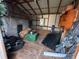 Interior view of a cluttered storage shed at 7289 Hemlock Rd, Ocala, FL 34472