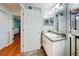 Clean and bright bathroom with white vanity, mirror, and recessed lights at 8327 Sw 79Th Cir, Ocala, FL 34476
